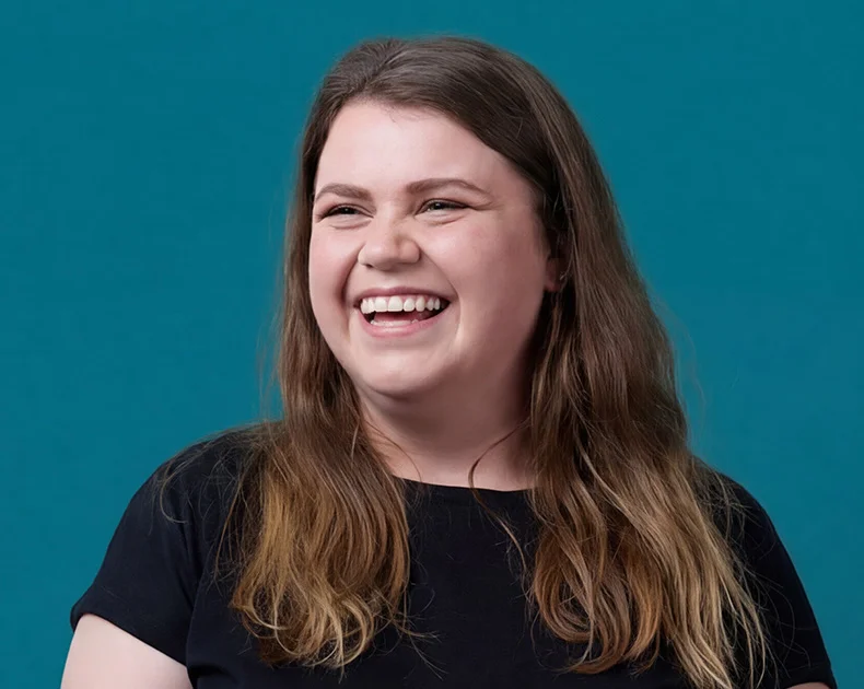 Woman smiling.