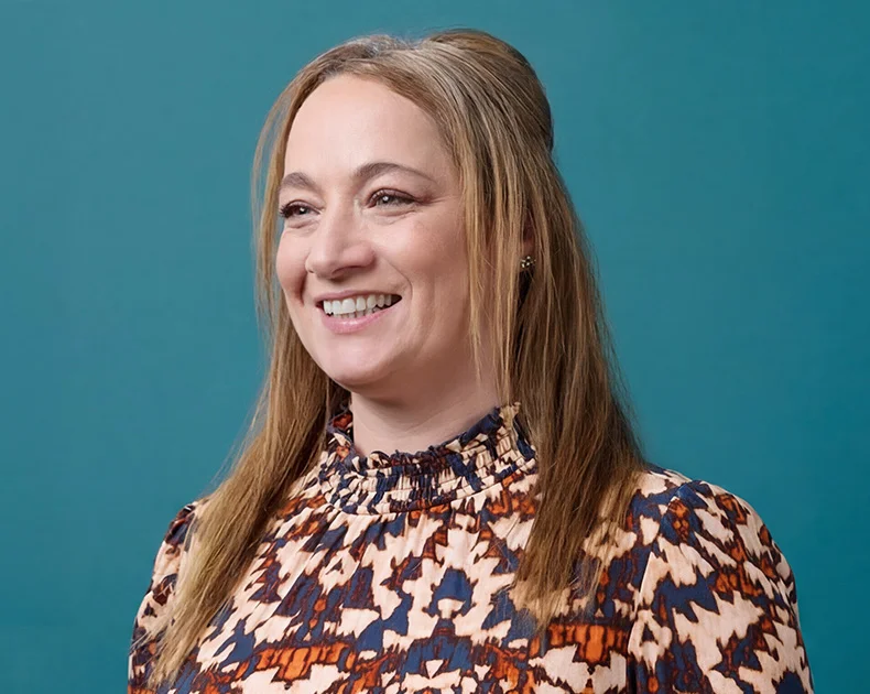 Woman smiling.