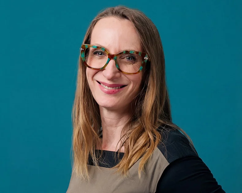 Woman smiling.
