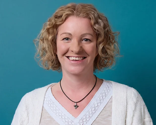 Woman smiling.