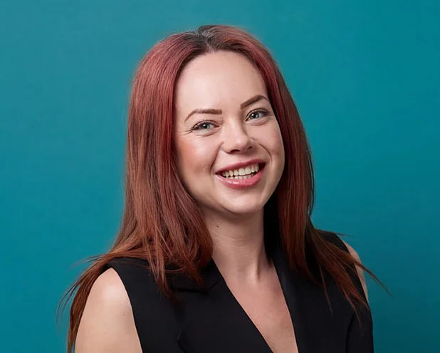 Woman smiling.