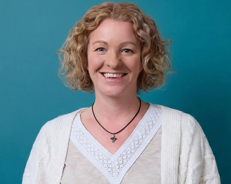 Woman smiling.